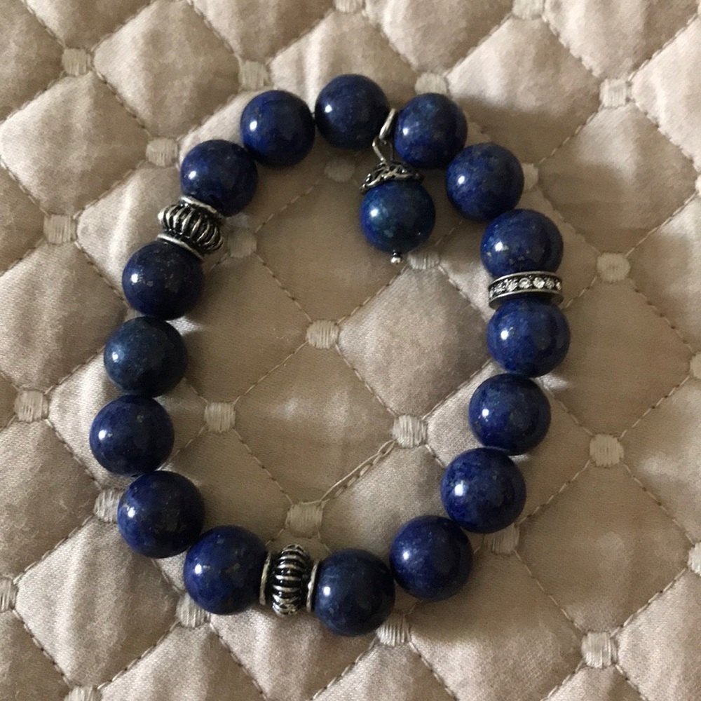 Blue lapis stone bead stretch bracelet with silver accents
